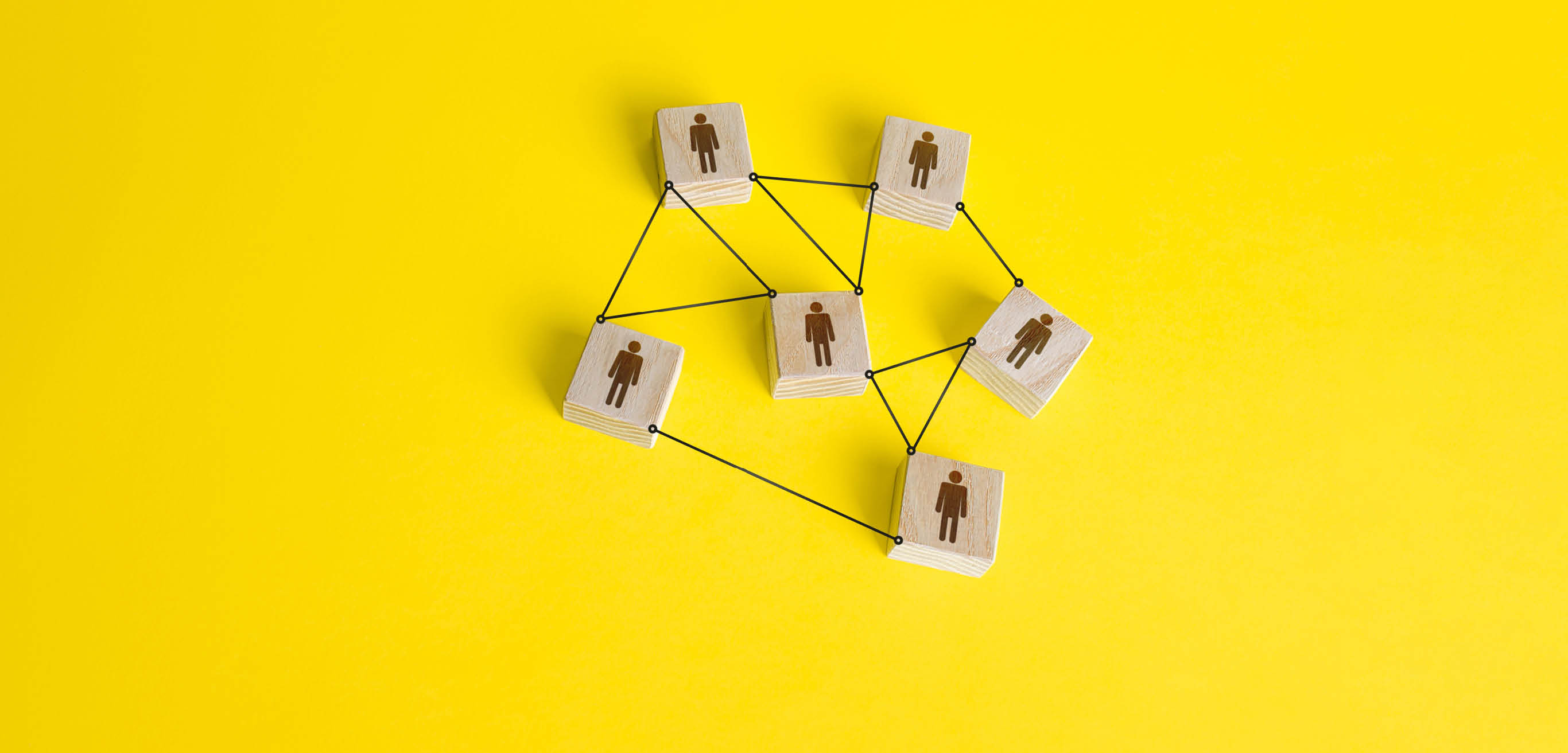Connected people figures form a working team network. Cooperation and division of responsibilities among project participants. Social communication. An efficient small optimal compact business team.