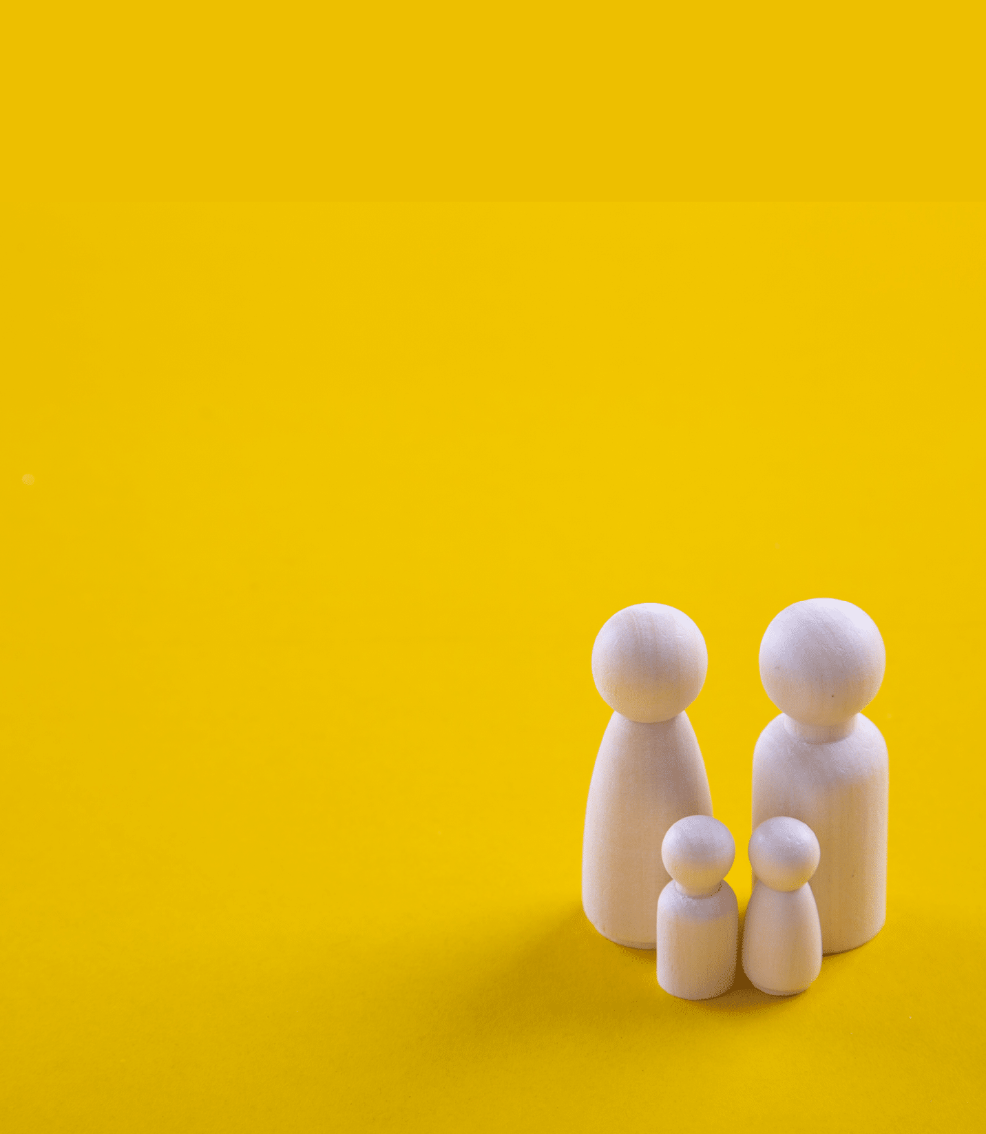 Wooden figurines of a family. Concept of a loving family.